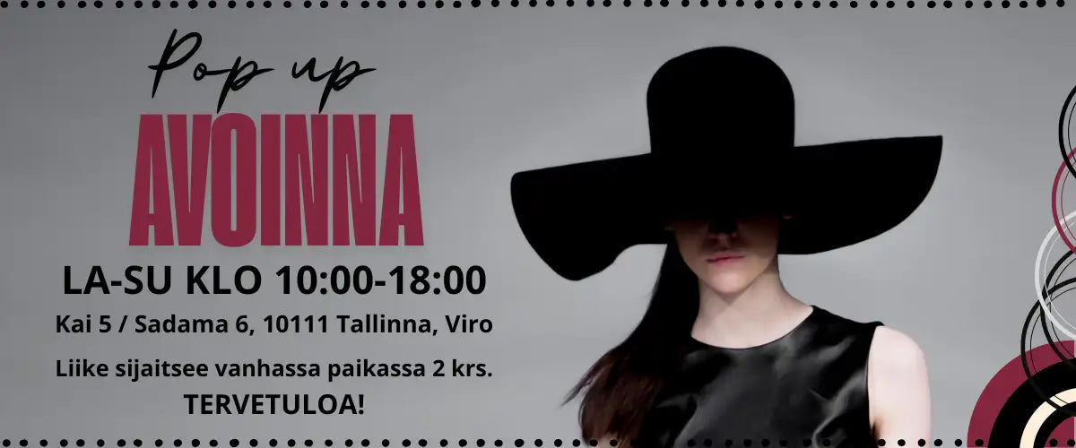 Nainen leveälierisessä mustassa hatussa.